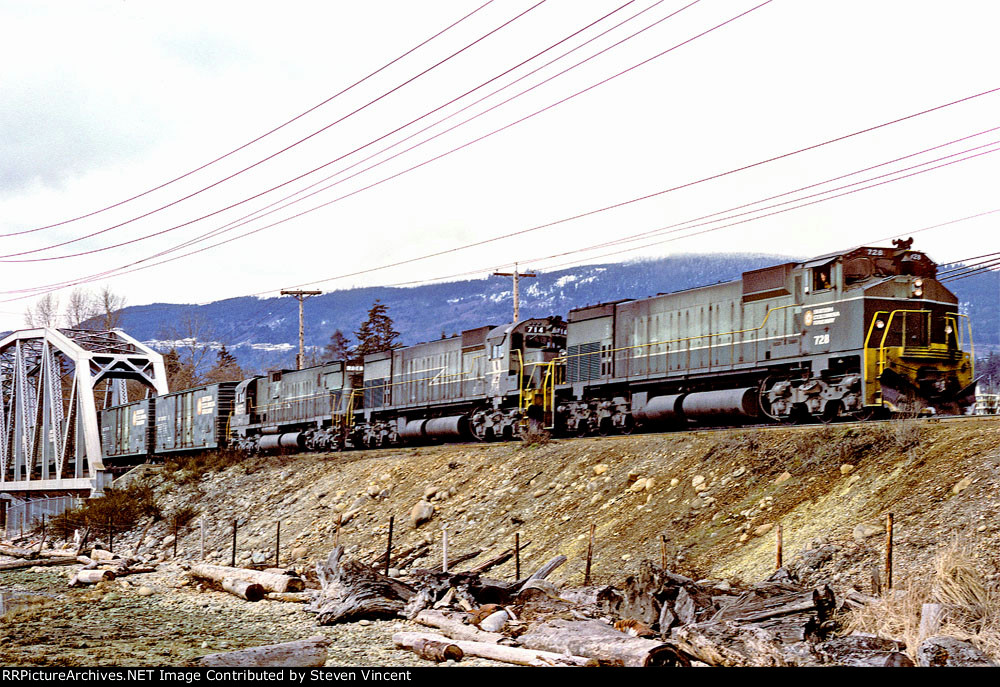 British Columbia Railway train with BCOL #728 leading nears yard.